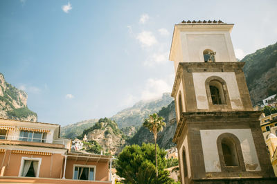 Low angle view of building and mountains at positano