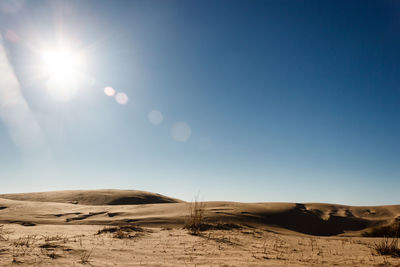 Scenic view of desert against clear sky