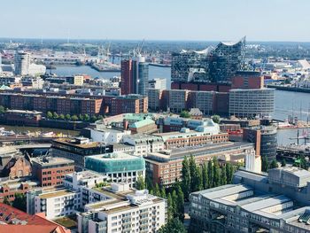 High angle view of buildings in city against clear sky