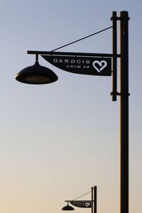 Low angle view of street light against sky