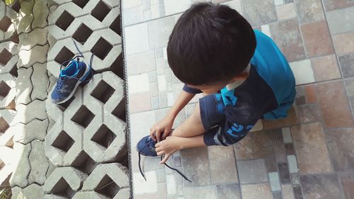 High angle view of boy playing outdoors