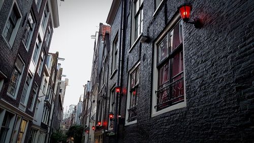 Low angle view of red building against sky