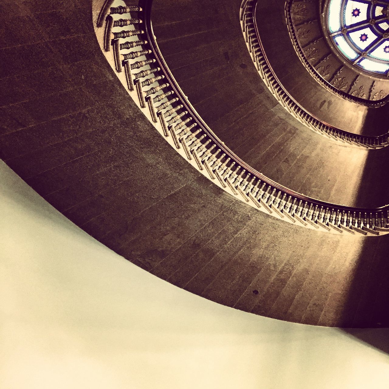 indoors, close-up, arts culture and entertainment, spiral, pattern, music, spiral staircase, low angle view, design, part of, circle, metal, steps and staircases, time, staircase, old-fashioned, musical instrument, text, architecture, technology