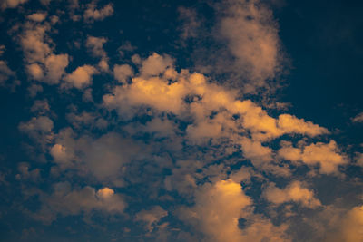 Low angle view of clouds in sky during sunset