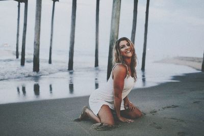 Portrait of smiling young woman in water