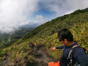 Full length of man on mountain against sky