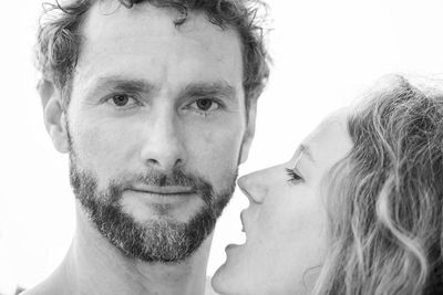 Close-up of young man against white background