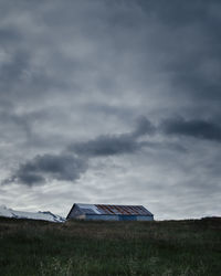 House on field against sky