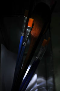 High angle view of paintbrushes in container