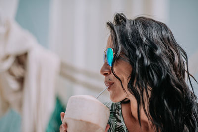 Portrait of woman drinking coffee