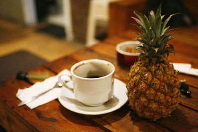 Coffee and cup on table