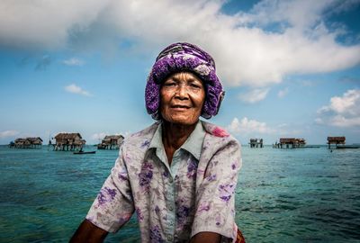 Portrait of man in sea against sky