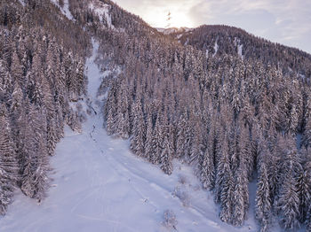 Scenic view of snow covered mountains against sky