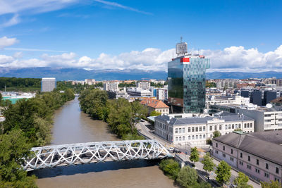 High angle view of bridge over river amidst buildings in city