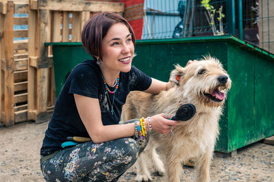 Dog at the shelter. animal shelter volunteer takes care of dogs.