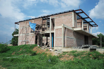 Perspective house under construction with clear blue sky background