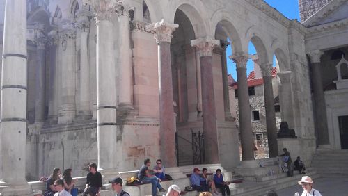 Tourists in the courtyard of a temple