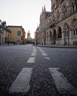 View of street amidst buildings in city