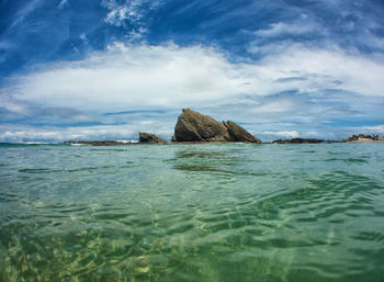 Scenic view of sea against cloudy sky