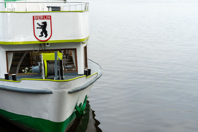 High angle view of text on boat moored at lake