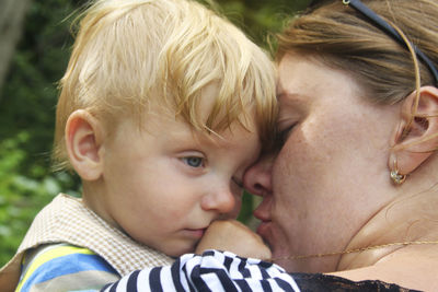 Close-up portrait of a mother with baby