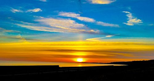 Scenic view of sunset over calm sea