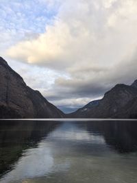 Scenic view of lake and mountains against sky
