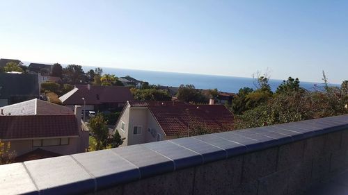 Residential structures against blue sky