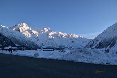 Snowcapped mountains against clear sky