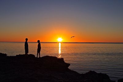 Scenic view of sea at sunset