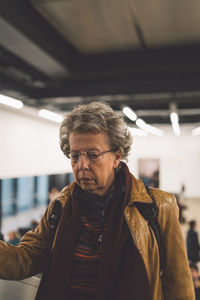 Thoughtful woman standing outdoors