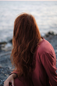 Rear view of woman looking at sea