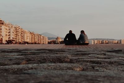 Rear view of man and woman looking at view