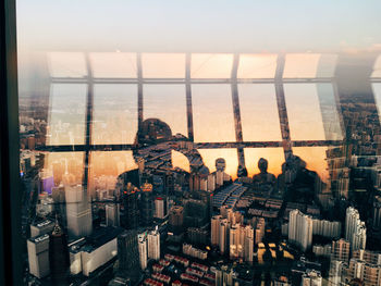 Cityscape against sky seen through window