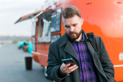 Young man using mobile phone