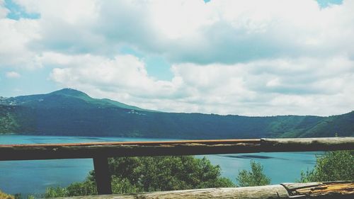 Scenic view of lake against cloudy sky