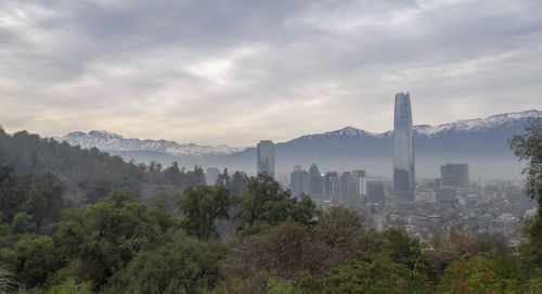 High angle view of trees and buildings against sky