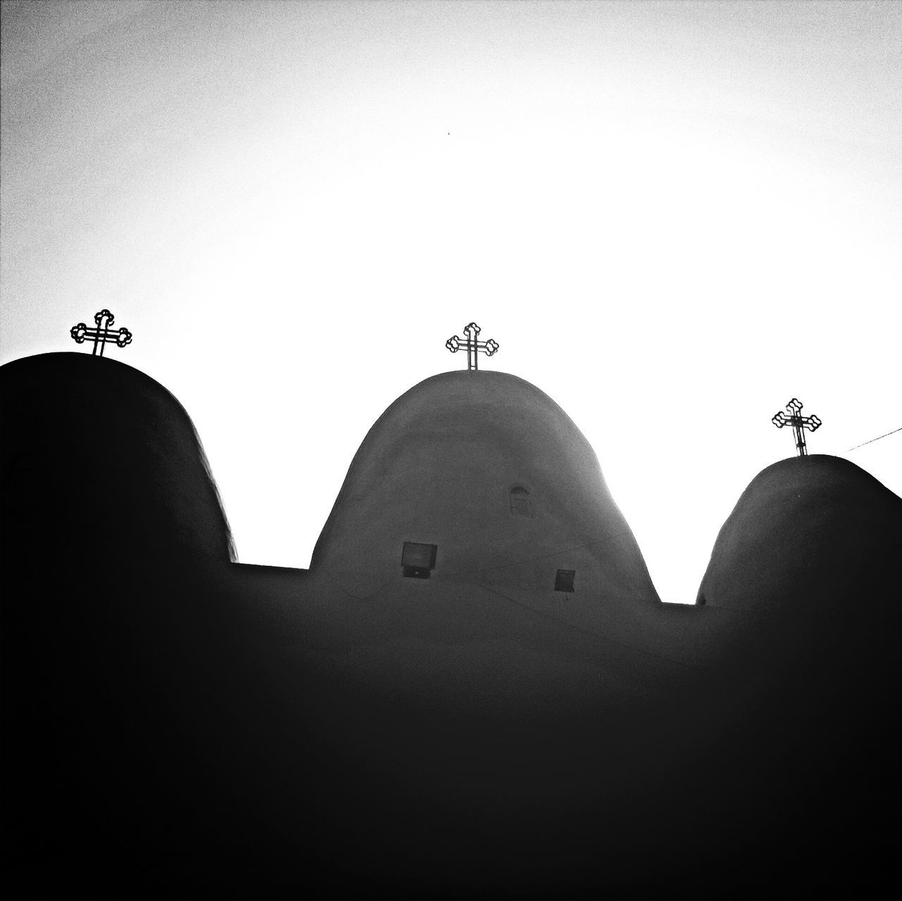 LOW ANGLE VIEW OF SILHOUETTE BUILT STRUCTURES AGAINST SKY