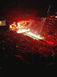 Rear view of people enjoying at concert