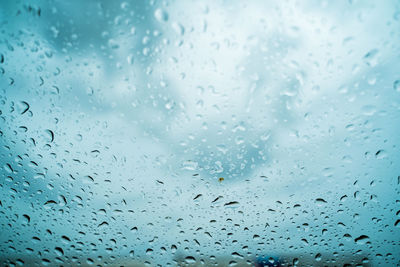 Full frame shot of wet glass window