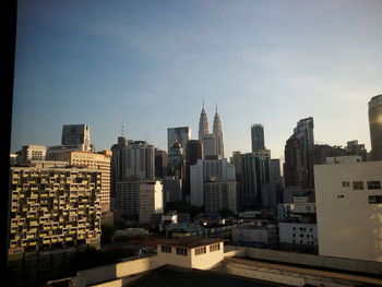 Modern buildings in city against sky