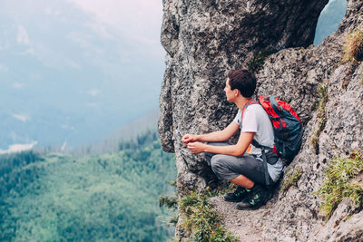 Full length of a man on mountain against sky