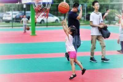 Group of people playing with ball