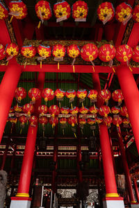 Low angle view of illuminated lanterns outside building