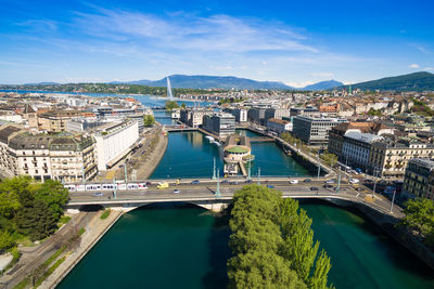 High angle view of bridge over river in city against sky