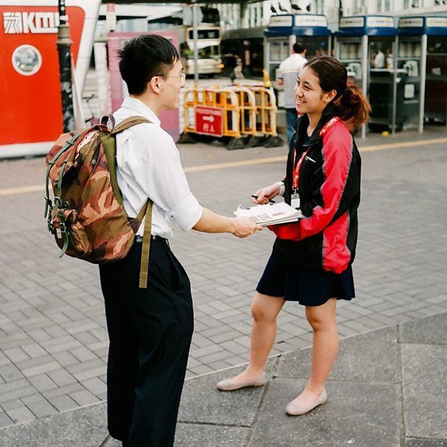 casual clothing, full length, lifestyles, person, standing, young adult, leisure activity, street, front view, togetherness, building exterior, young men, city, sidewalk, three quarter length, happiness