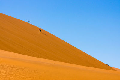 Scenic view of desert against clear sky