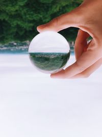 Cropped image of hand holding glass