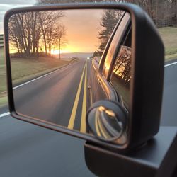 Reflection of road on side-view mirror