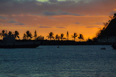 Scenic view of sea against orange sky